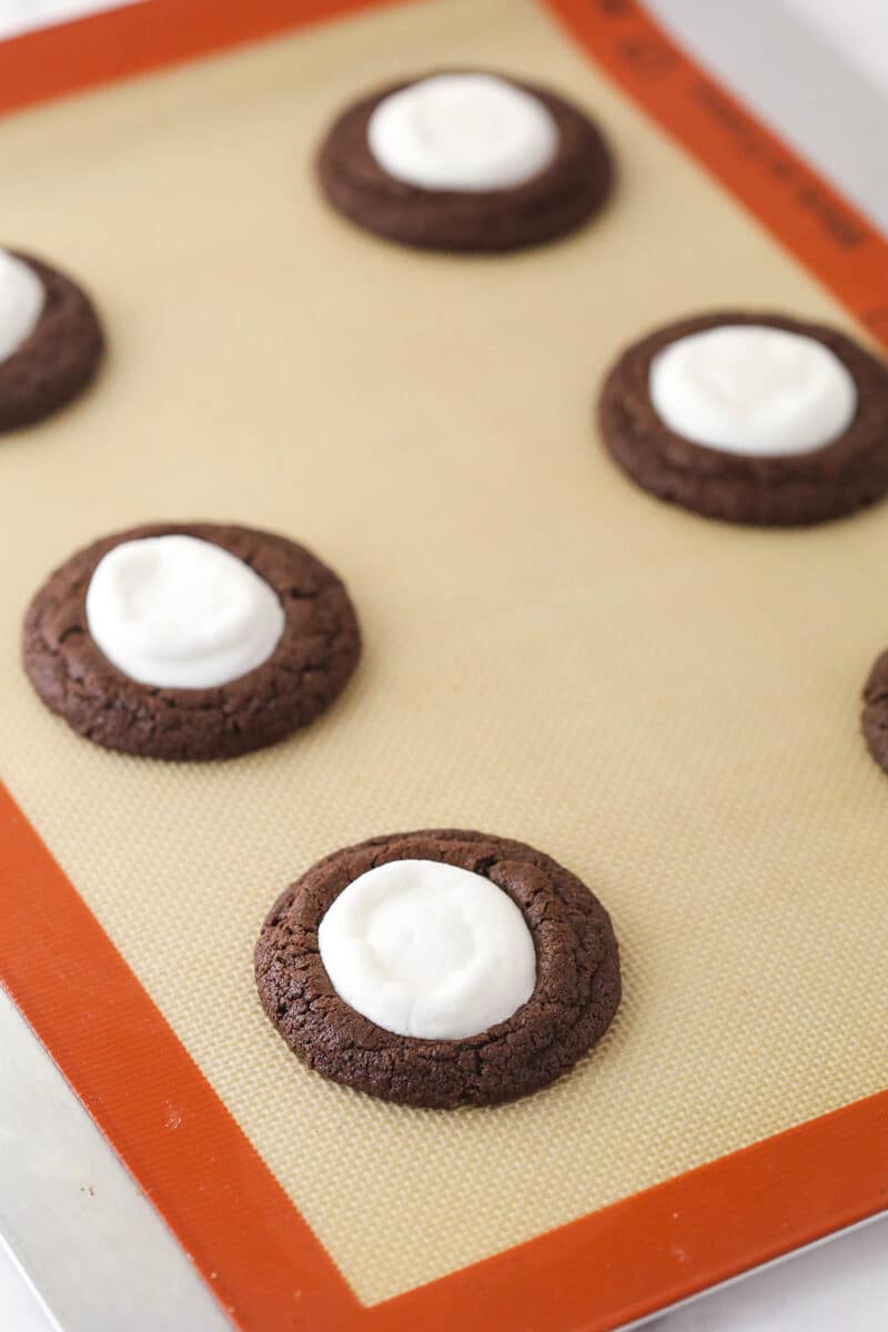 Chocolate and marshmallow cookies on a baking sheet