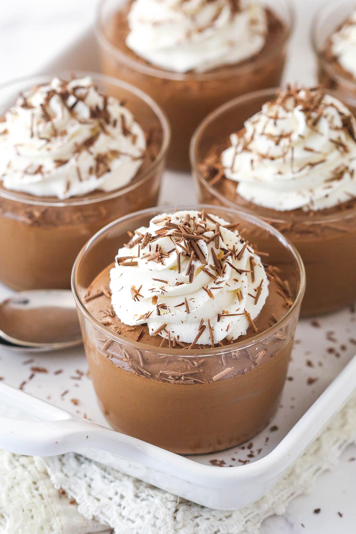 Incredibly rich and silky smooth, this Chocolate Mousse is the real deal. It's easier than you may think and requires just 5 ingredients! Cups of chocolate mousse topped with whipped cream