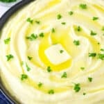 creamy mashed potatoes with parsley on top