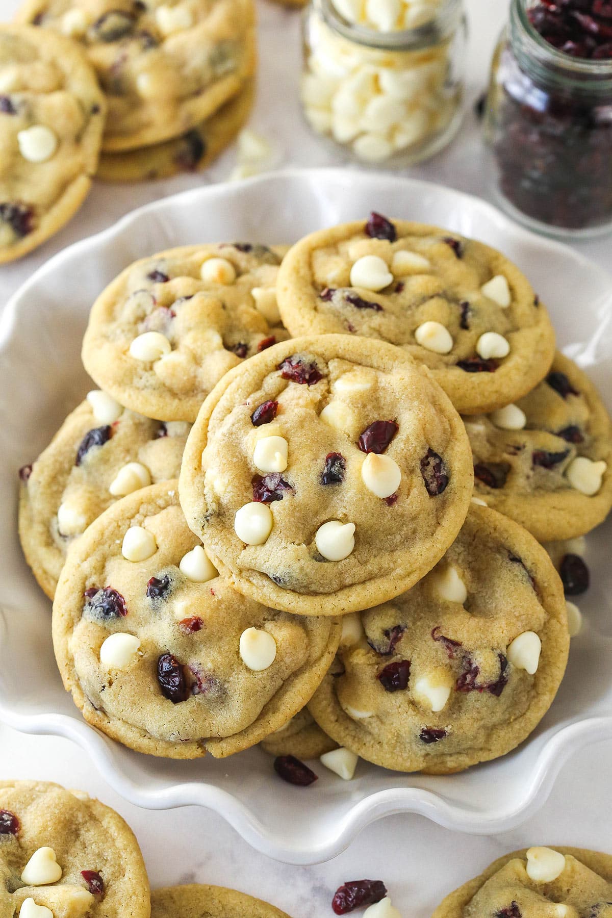 These Cranberry White Chocolate Chip Cookies are soft, chewy, and dotted with tart cranberries and sweet white chocolate chips in every bite. Cranberry white chocolate chip cookies in a bowl