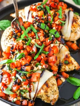 Bruschetta Chicken in a black pan