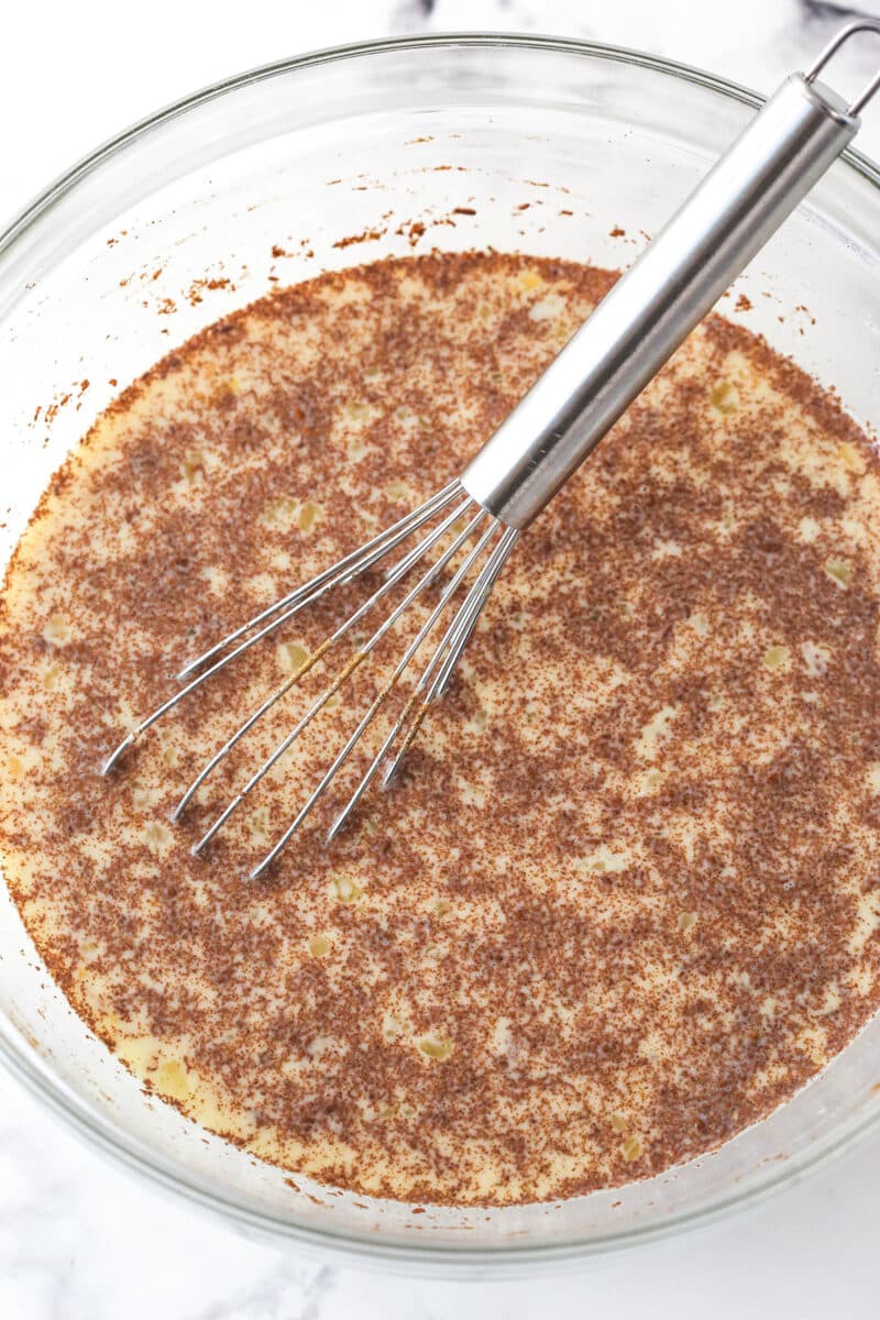 Whisking together the custard for berry French toast casserole.