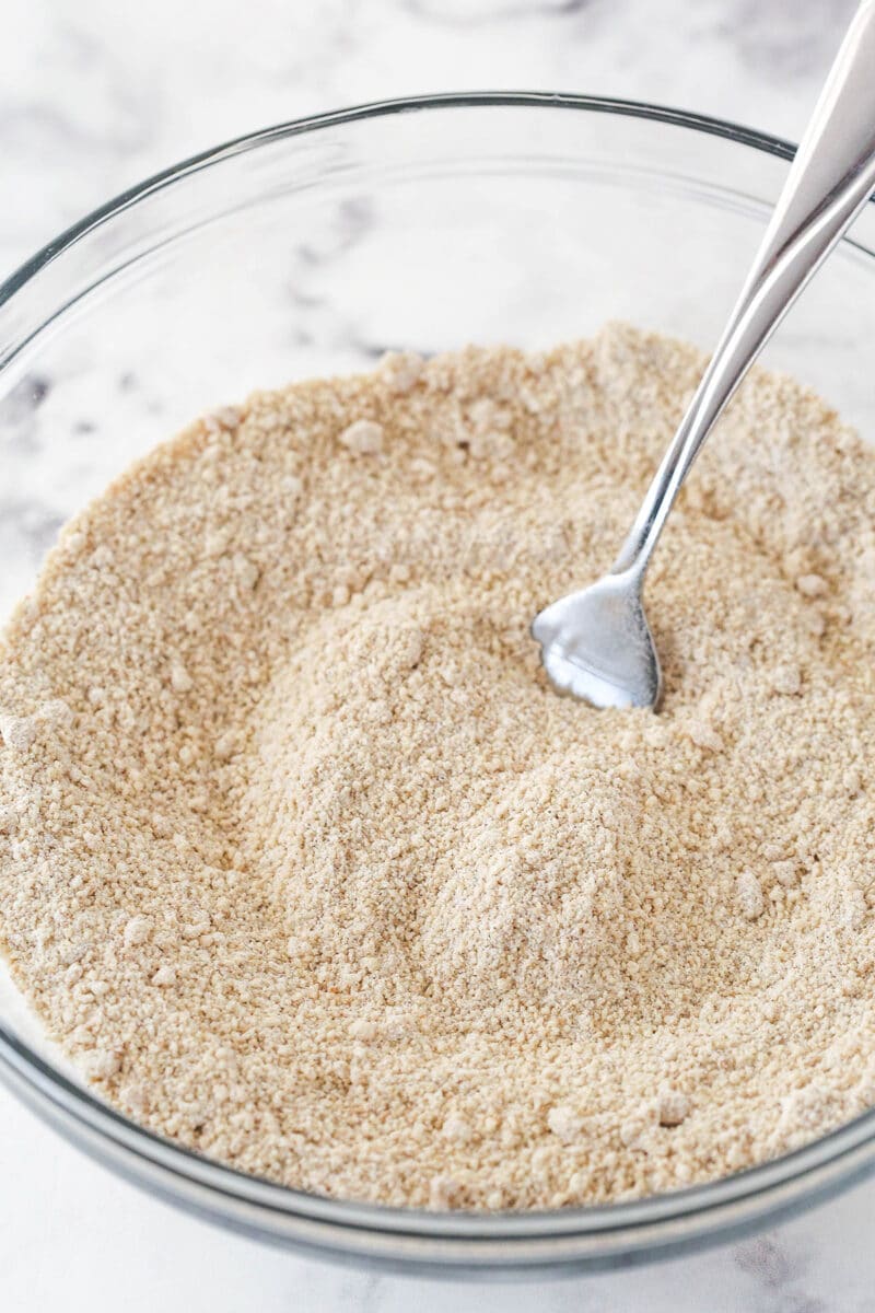 Mixing together the dry ingredients for a streusel topping.