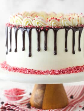 Chocolate peppermint layer cake on a cake stand.