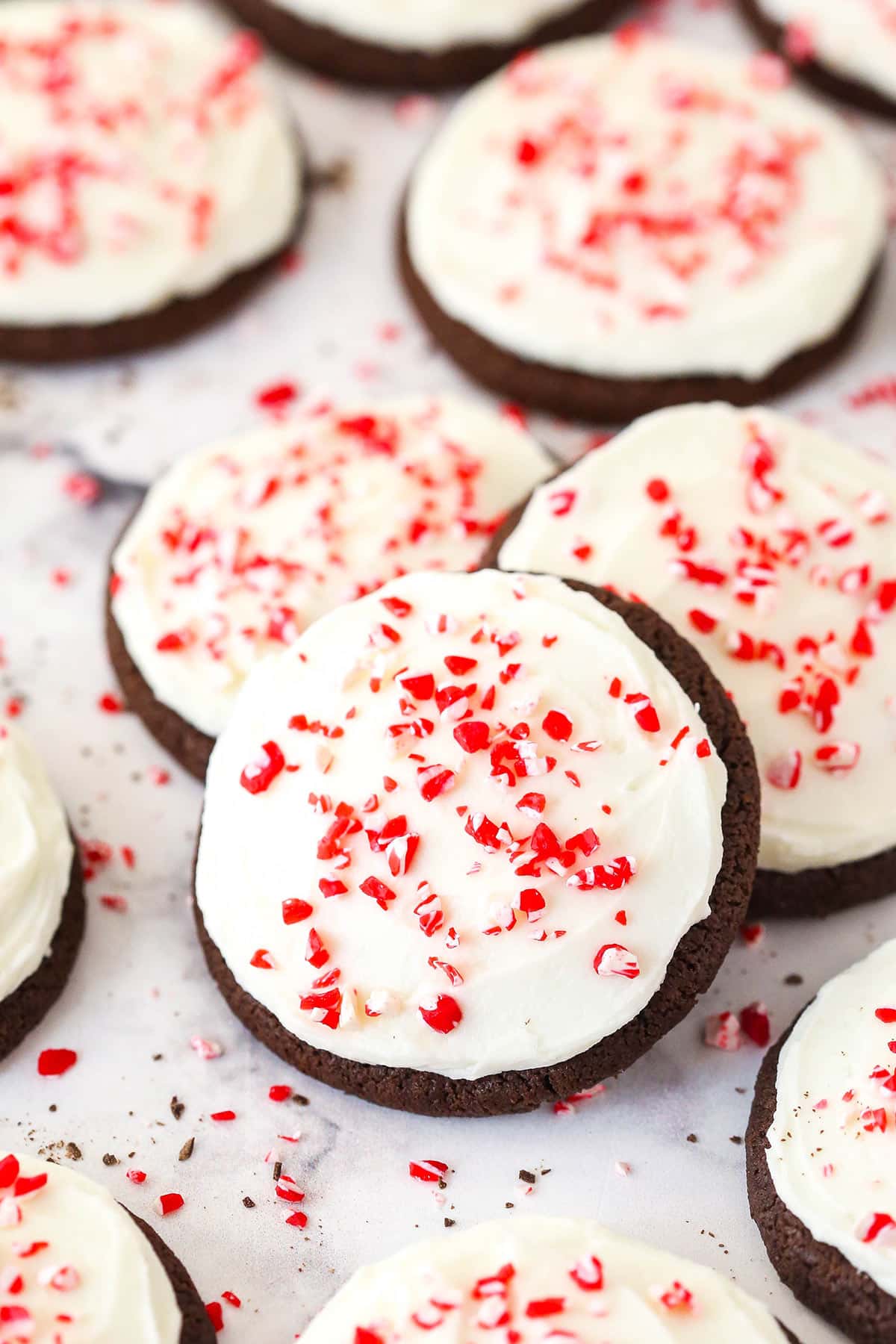 A few Peppermint Frosted Chocolate Cookies in a pile on the counter.