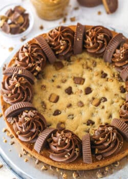 Reese's peanut butter cookie cake on a serving plate.