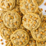 Overhead view of salted butterscotch cookies piled on a white countertop.