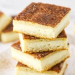 A Pile of Sopapilla Bars on a Plate Dusted with Cinnamon Sugar