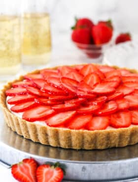 strawberry champagne tart on silver platter