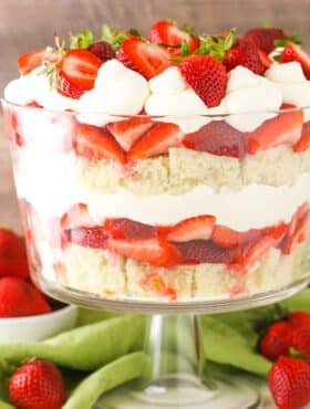 Side view of a full Strawberry Shortcake Trifle in a glass trifle dish